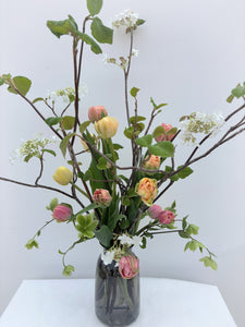 Bouquet of tulips and viburnum from Quebec in vase